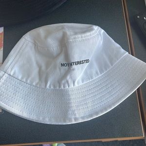 White bucket hat with black lettering